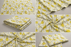 Collage of yellow and white floral fabric on a gray background