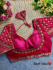 Dark pink fabric with intricate sequence and codding thread work design, displayed in a side view.