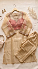 Beige soft tissue suit set flat lay with kurta, palazzo and crop top
