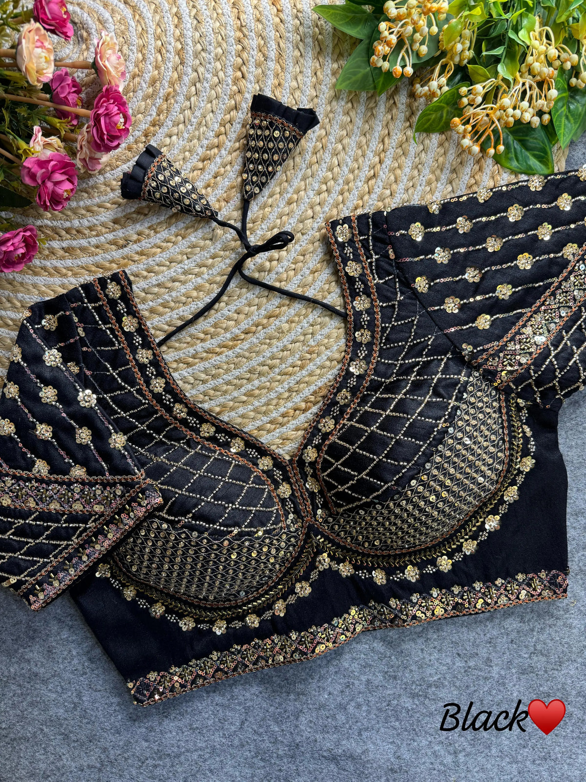 Black blouse featuring intricate sequence and codding thread work on soft silk fabric.