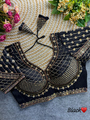 Black blouse featuring intricate sequence and codding thread work on soft silk fabric.