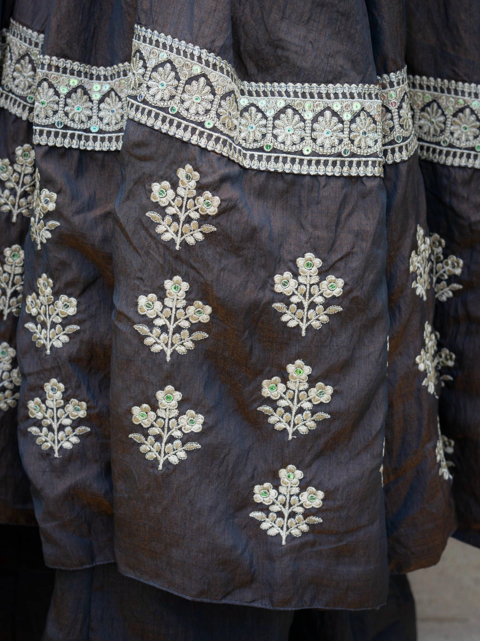 Black Sequins Anarkali Suit hem border close up with floral booti sequins embroidery