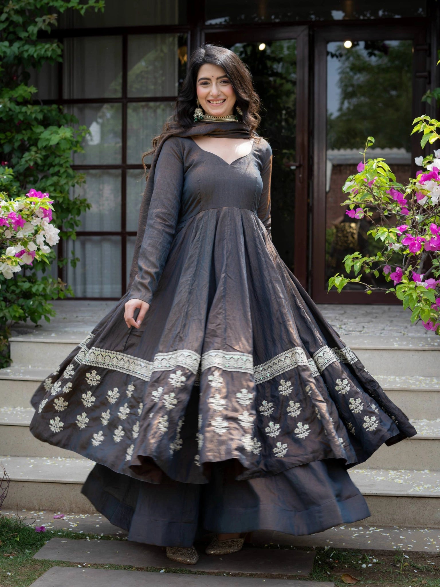 Black Sequins Anarkali Suit twirling shot showing full flare and embroidered hem