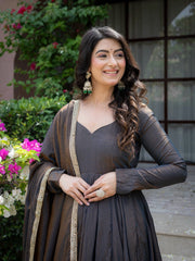 Black Anarkali Suit close up portrait showing V neckline and gold earrings