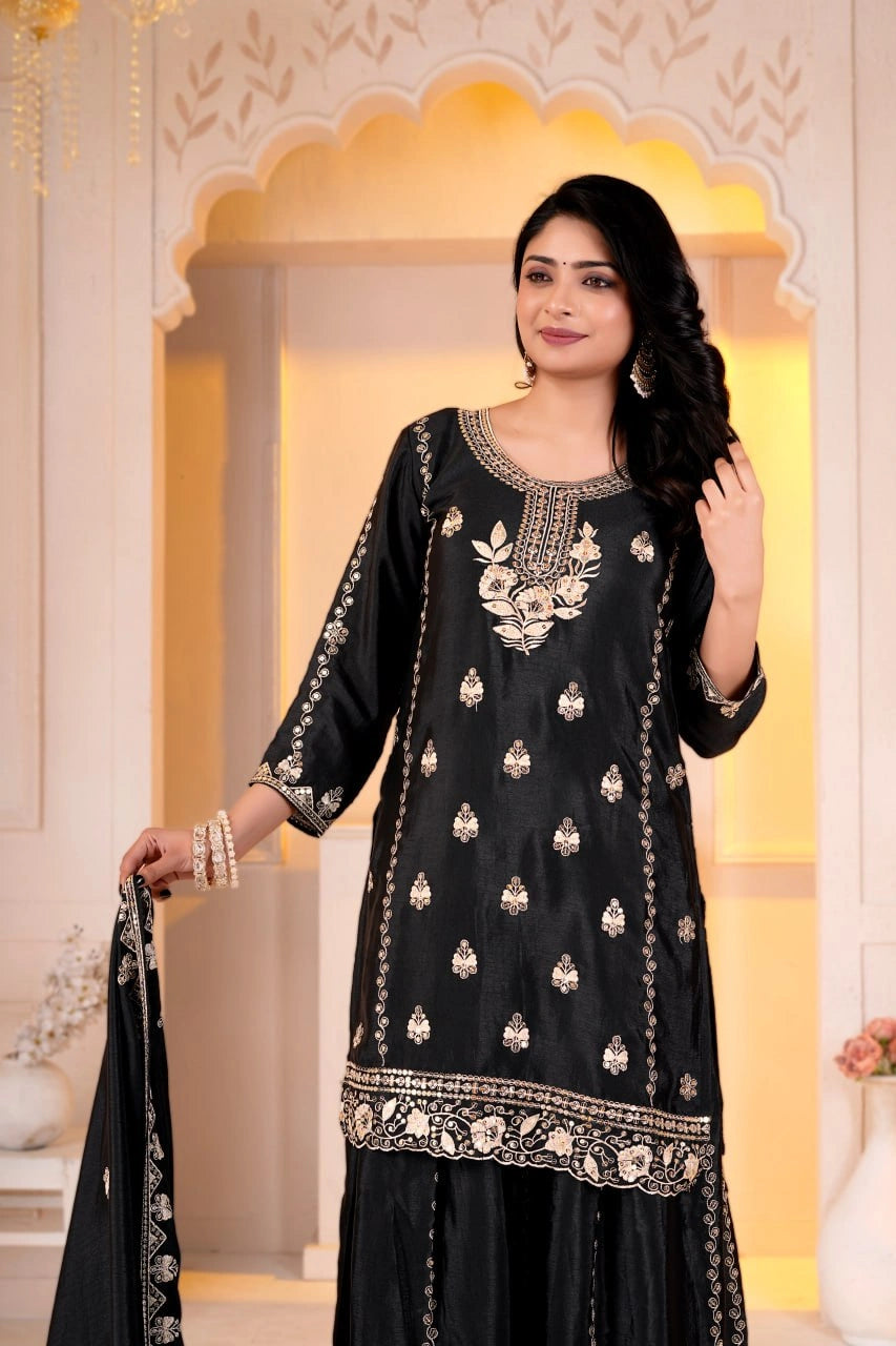 Black Sharara Suit close up portrait showing round neckline and chest floral sequins embroidery