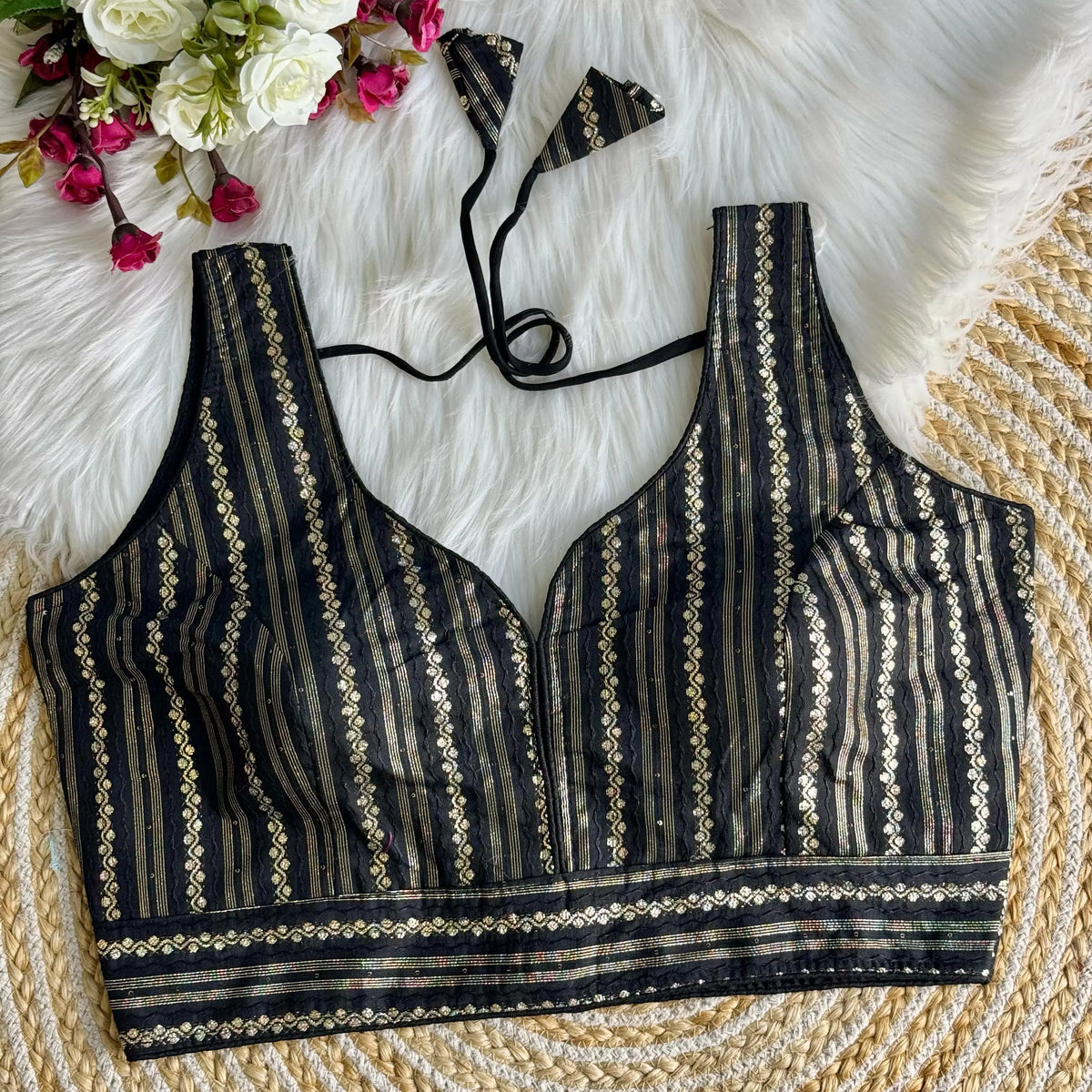 Elegant Black Zari Work Silk Blouse featuring intricate embroidery, perfect for festive and traditional occasions.