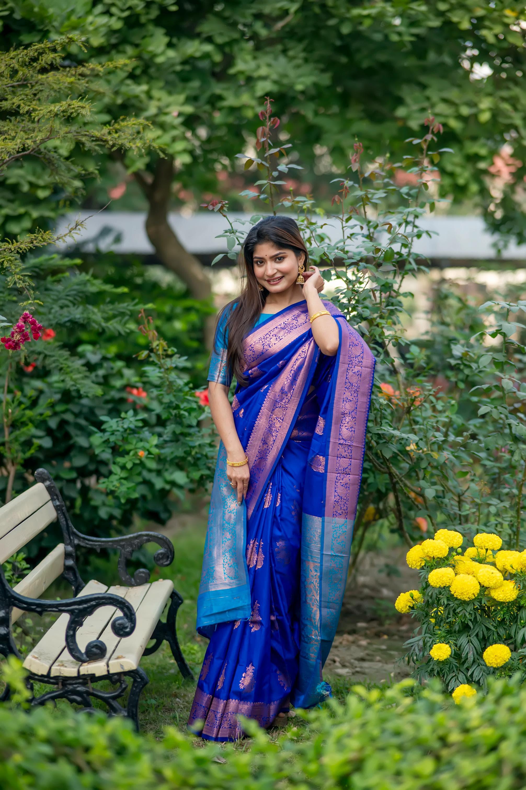Blue saree with zari work and contrasting purple border