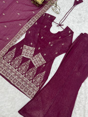 Burgundy suit flat lay - hem embroidery detail