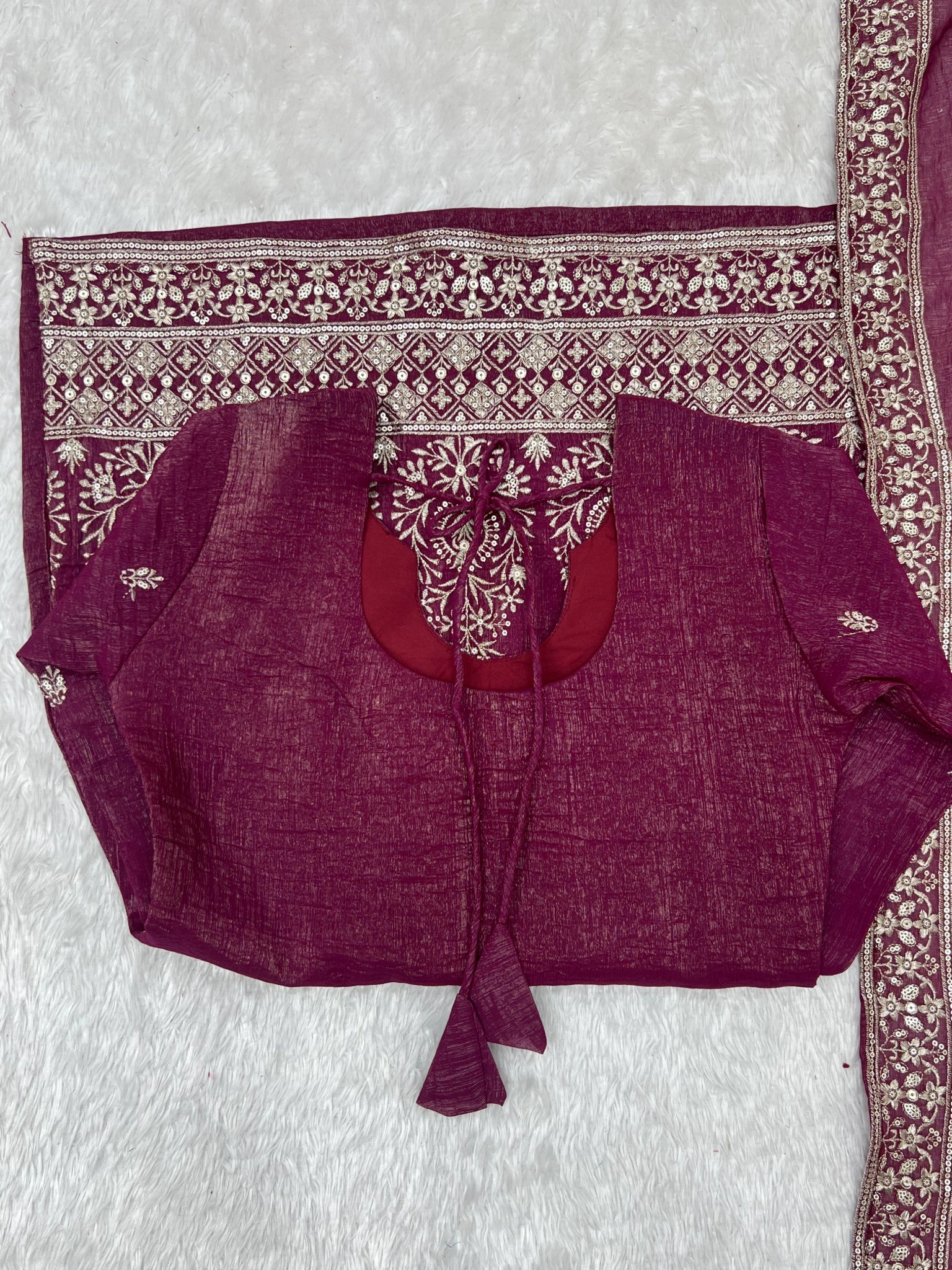 Burgundy suit flat lay - back tie-up detail