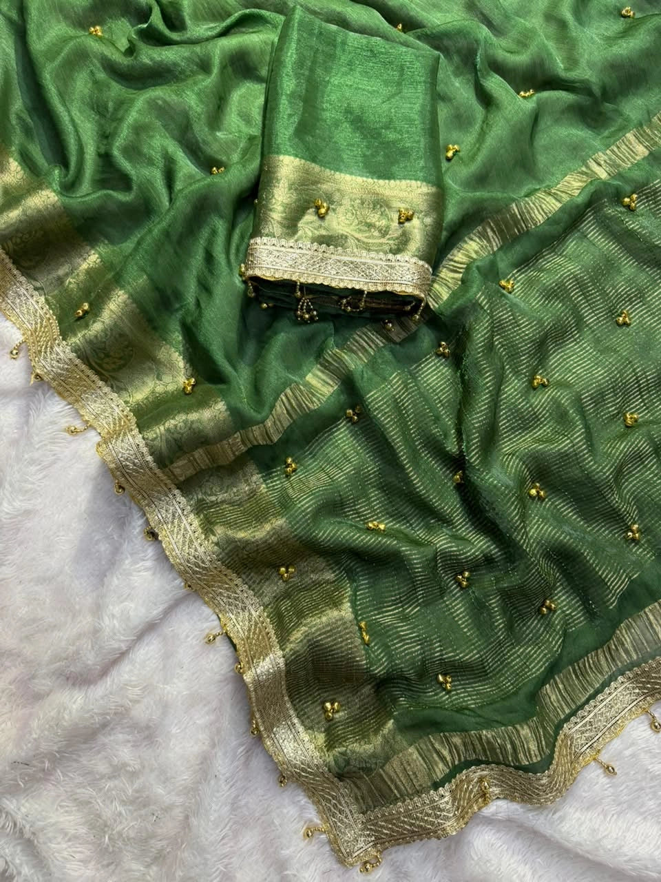 Dark Green saree ghungroo bells and lace border close view