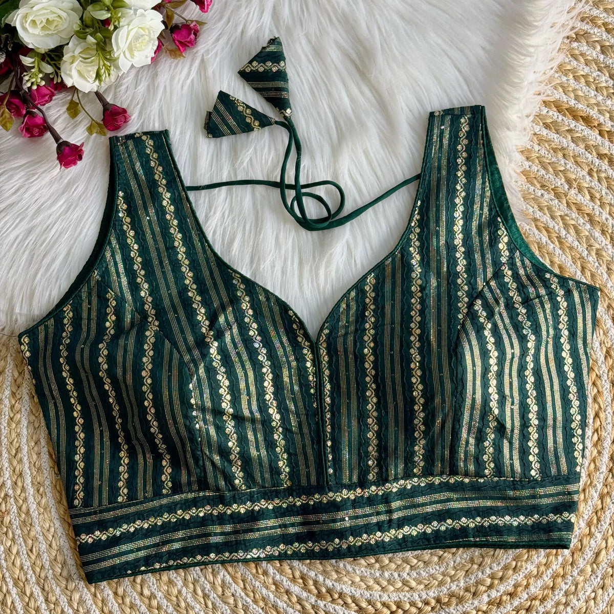 Elegant Dark Green Zari Work Silk Blouse crafted from silk fabric, featuring intricate embroidery patterns, perfect for festive and traditional occasions.
