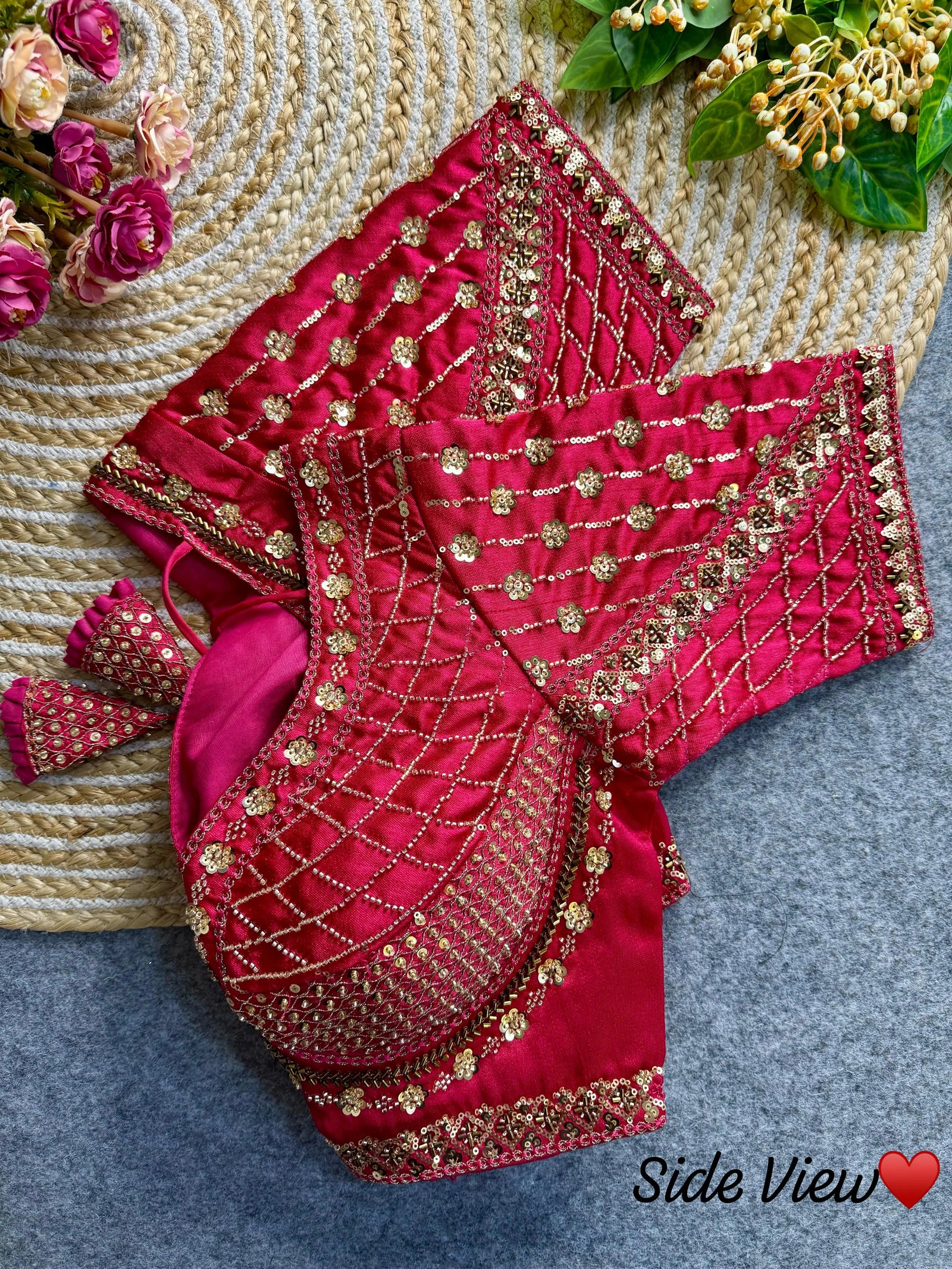 Dark pink blouse with intricate sequence and codding thread work, featuring floral and geometric patterns.
