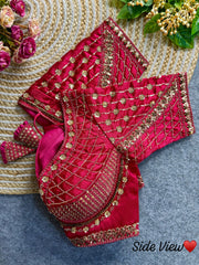 Dark pink blouse with intricate sequence and codding thread work, featuring floral and geometric patterns.