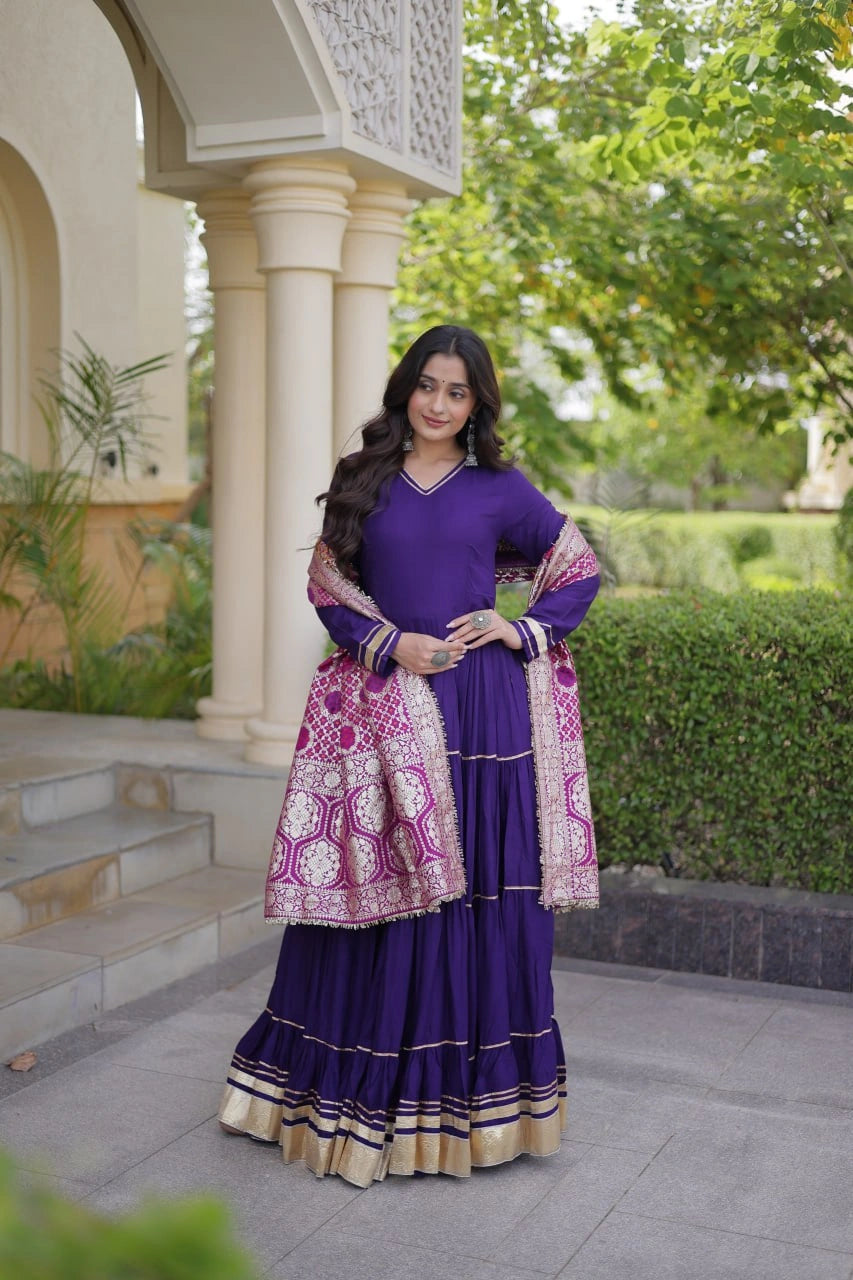 Deep Purple Anarkali Suit front model holding dupatta showing tiered gota patti work