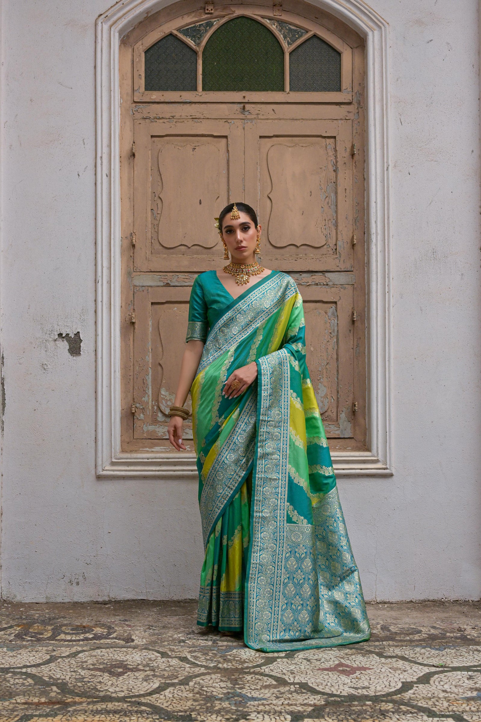 Green saree with Kadwa style weaving and multicolor stripes