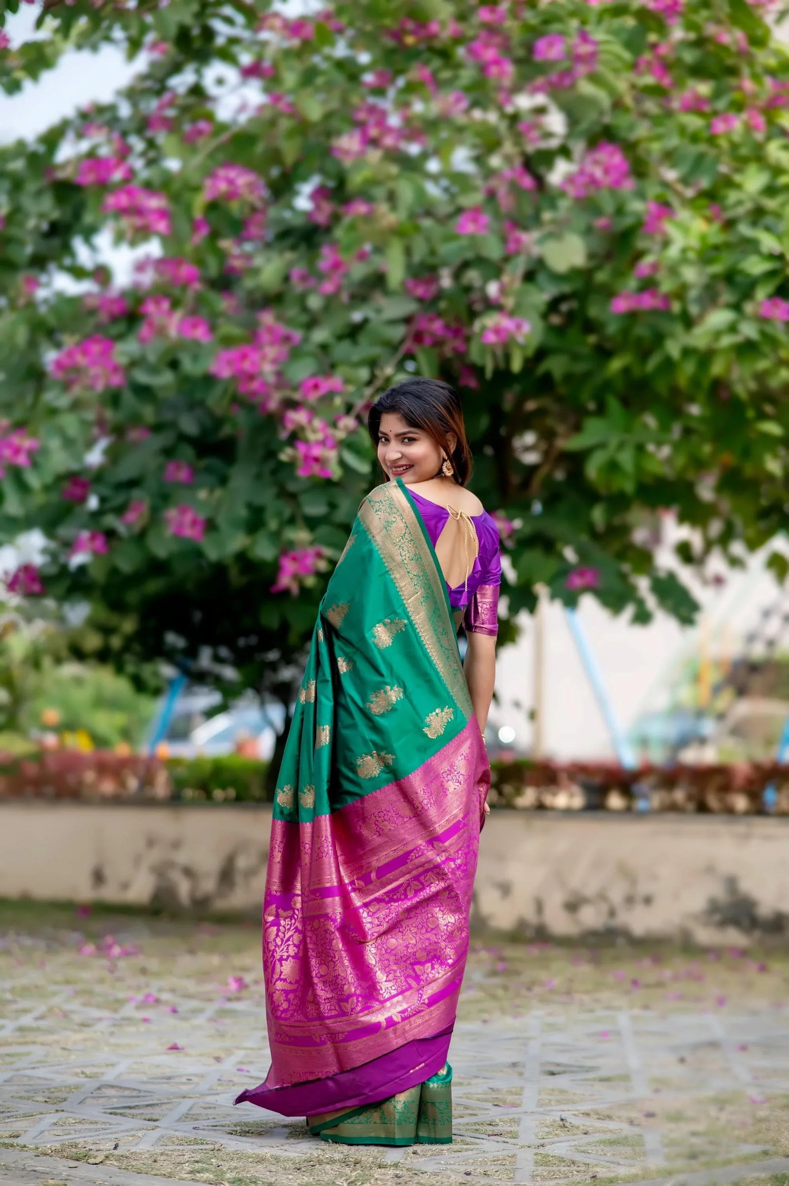 Green saree with zari work and contrasting pink border