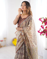 Woman wearing a patterned saree with a blurred background