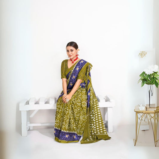 Woman wearing olive green Jaipur block print saree with traditional motifs and elegant accessories