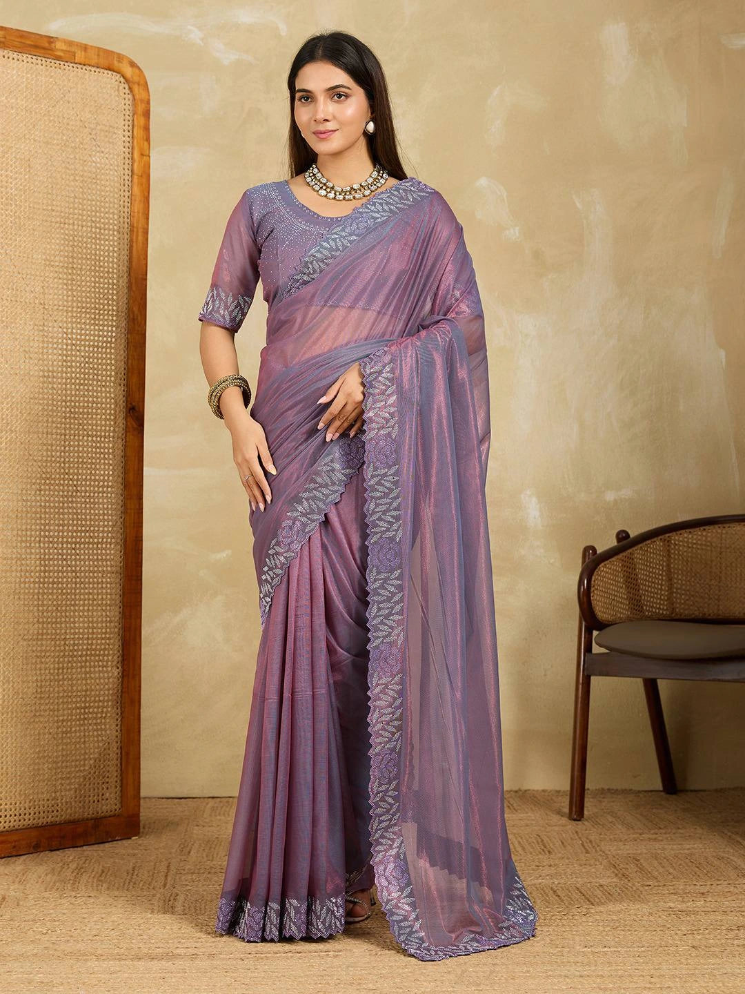 Lavender Swarovski Work Fendy Soft Net Saree worn by a model, showcasing elegant drape and shimmering embellishments.
