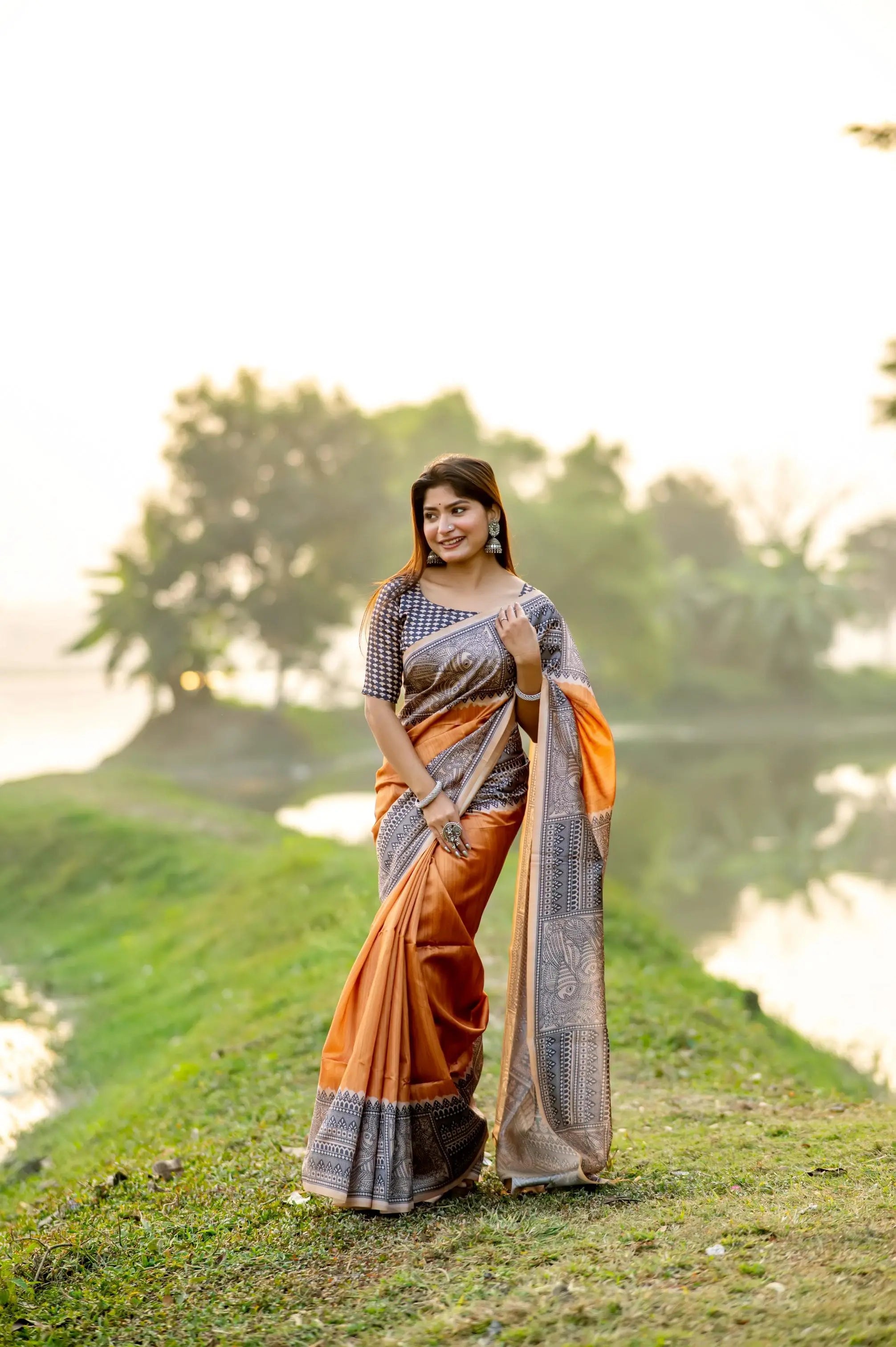 madhubani-print-orange-saree-woman-traditional-indian-outfit-outdoor
