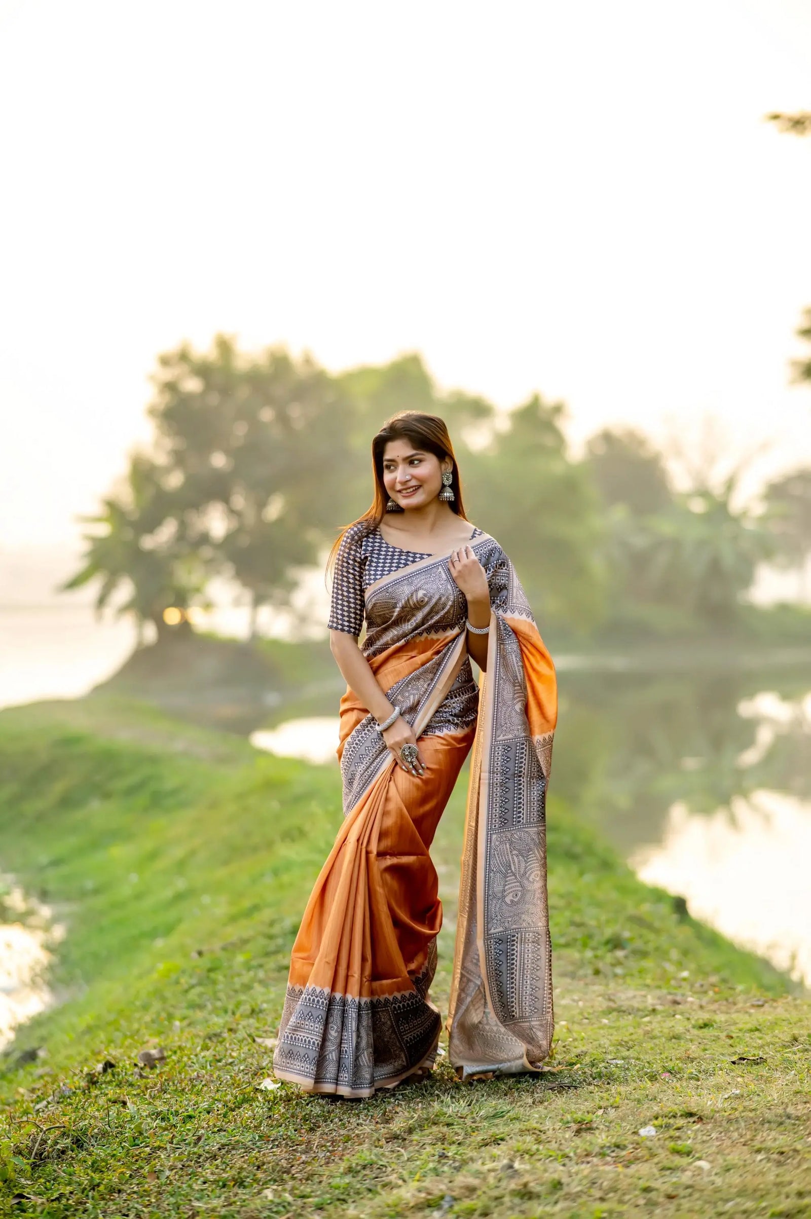 madhubani-print-orange-saree-woman-traditional-indian-outfit-outdoor