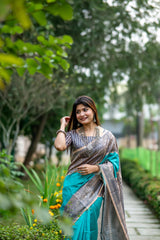 Teal Madhubani print saree with intricate traditional Indian artwork and ethnic detailing