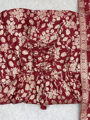 Close-up of lace-up dori back and Banarasi jacquard weave on maroon suit