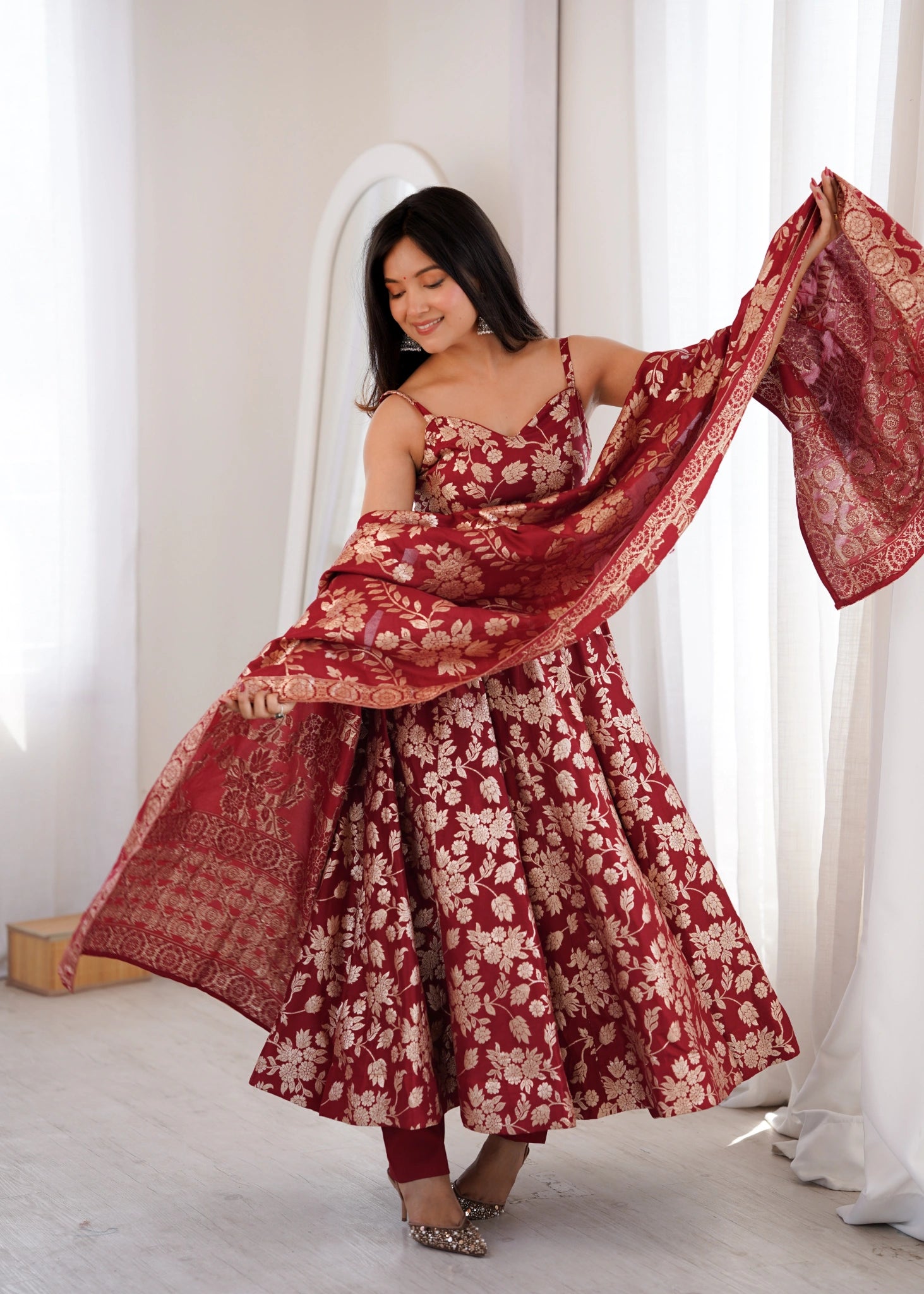 Maroon Banarasi jacquard suit styled with dupatta, three-quarter view