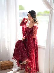 Maroon Bandhani Print Suit KU258 model holding dupatta at curtain