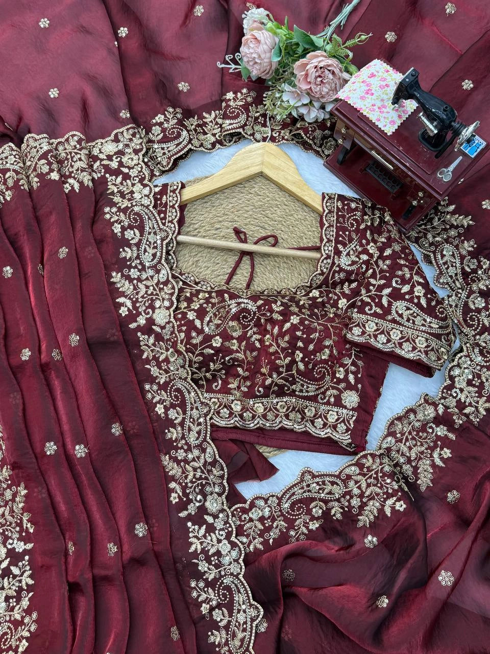 Maroon saree embroidered blouse and pallu close view