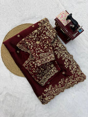 Maroon saree folded with embroidered running blouse piece