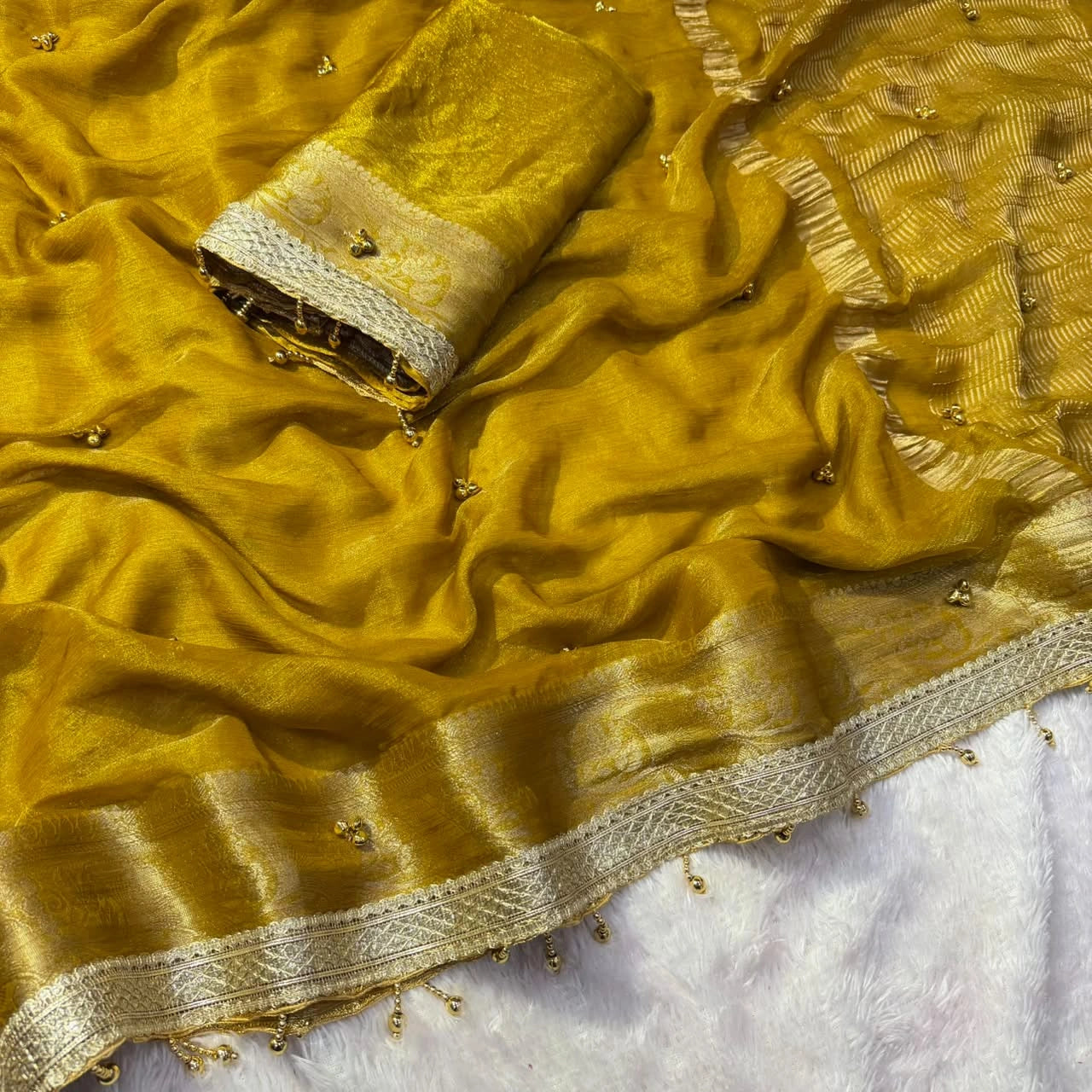 Mustard Yellow saree ghungroo bells and lace border close view