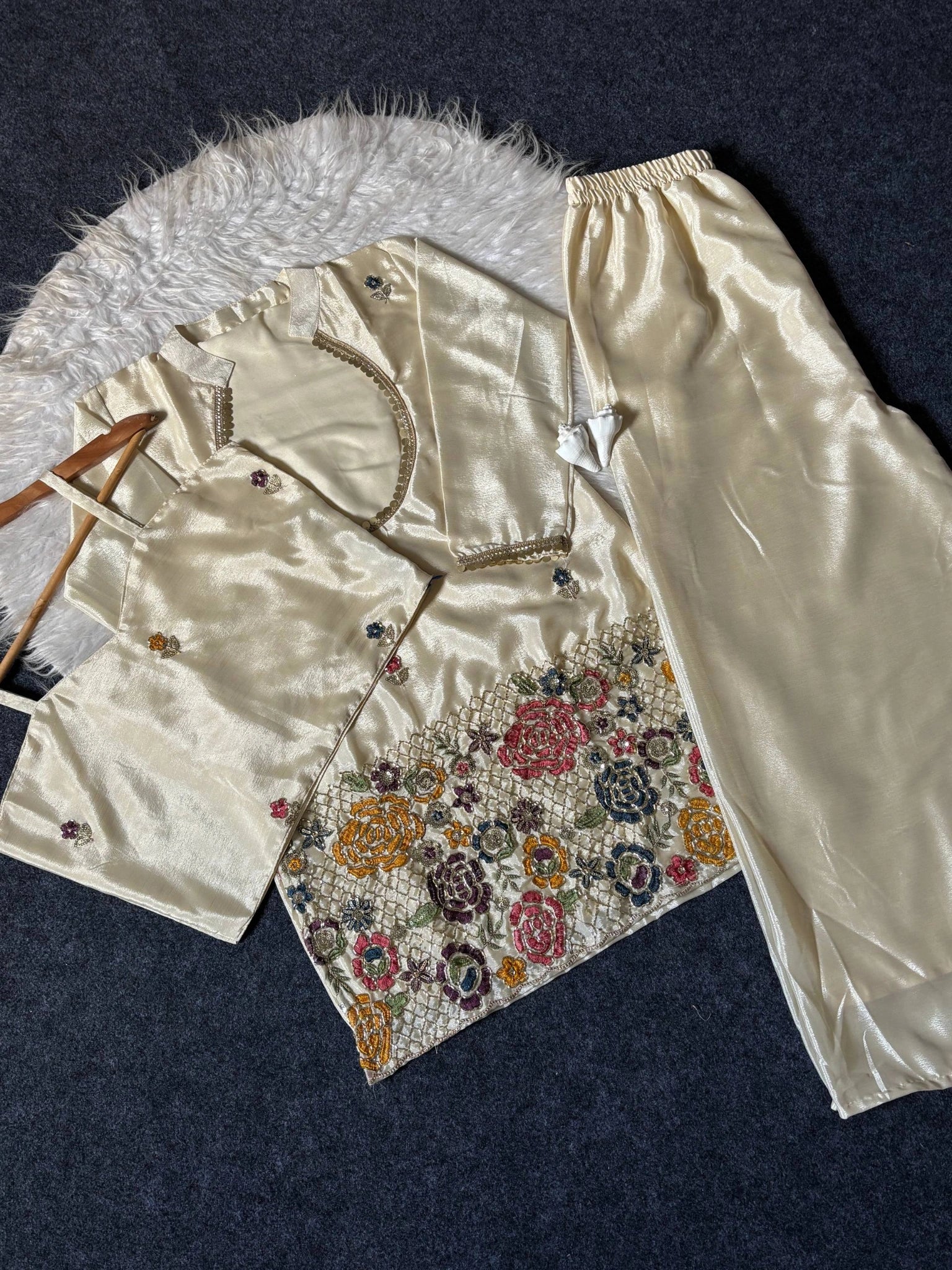 Off White Embroidered Beads and Kardana Work Suit flat lay on hanger