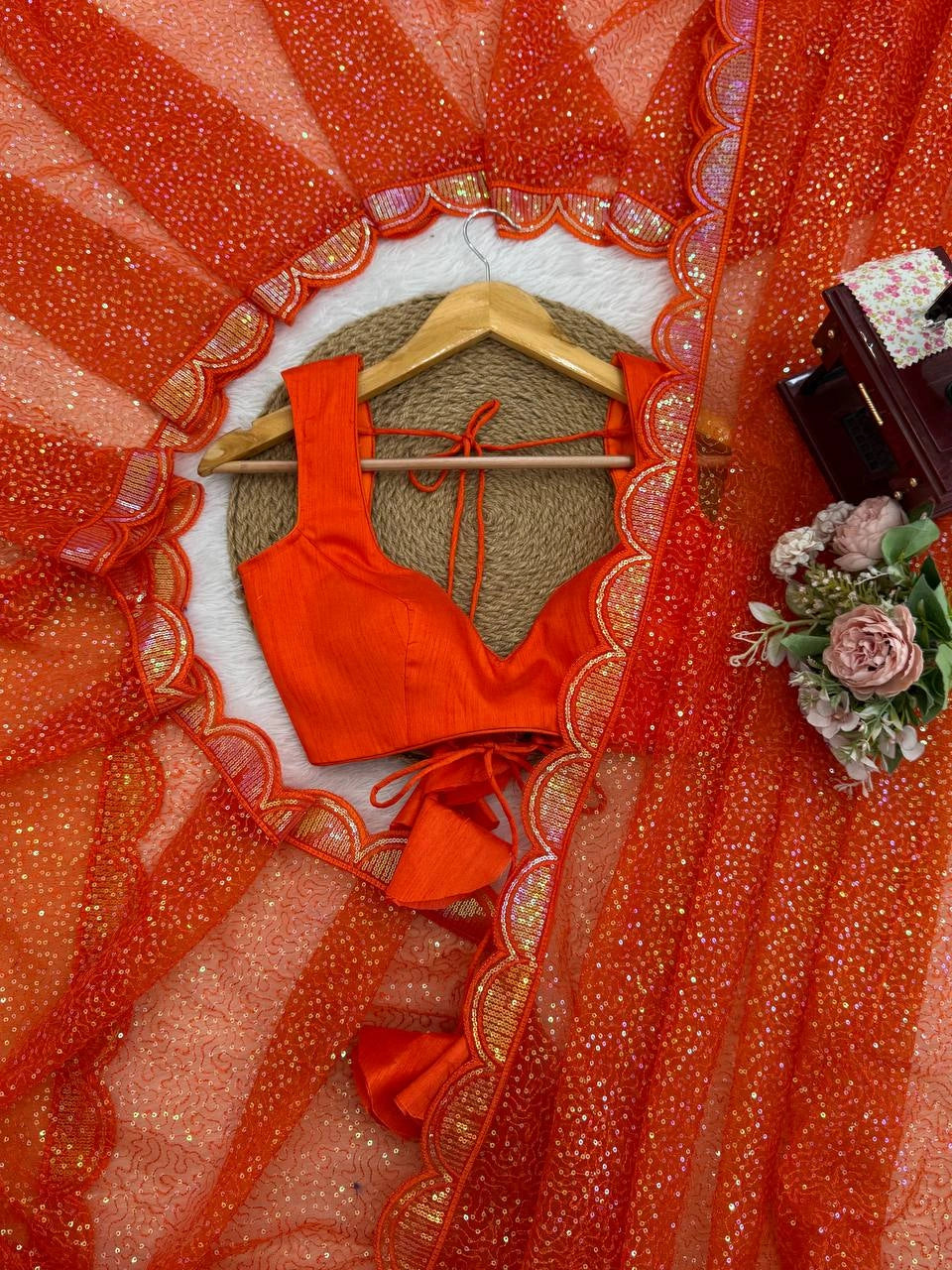 Orange sequins embroidery detail – flat lay with blouse