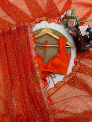 Orange net saree – blouse piece and sequin work flat lay
