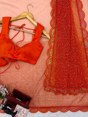 Orange saree scalloped border detail close-up