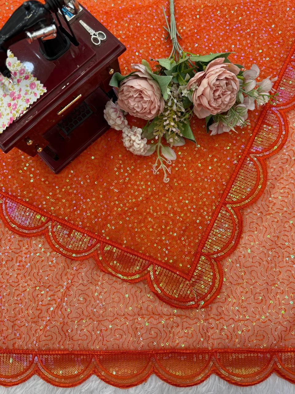Orange saree blouse piece and fabric – styled flat lay