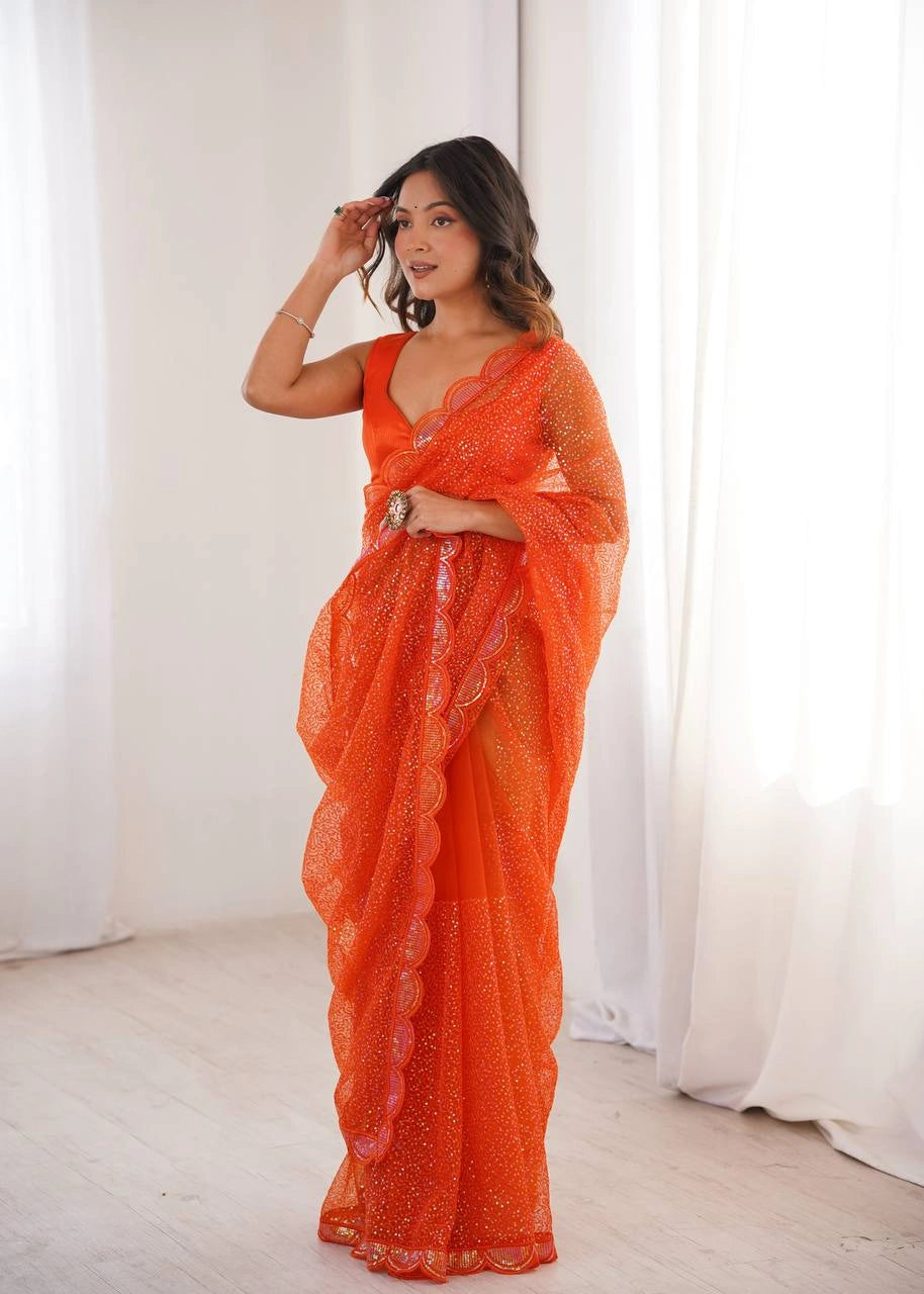 Orange sequins saree pallu drape on model