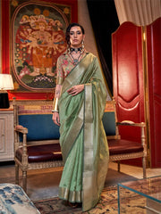 Elegant pastel sea green saree with intricate zari work, handloom woven in moss chiffon fabric from the Knoorie Seasons collection