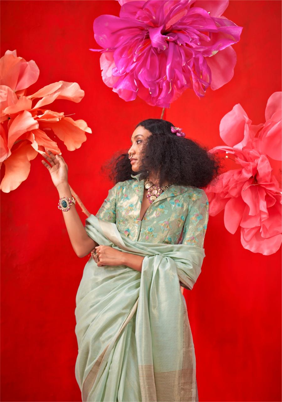 Pastel sea green saree with intricate zari work, handloom weaving