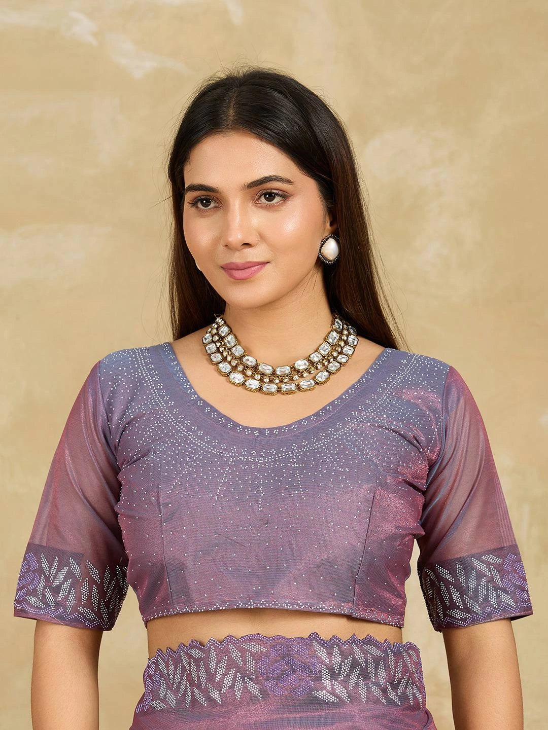 Lavender Swarovski Work Fendy Soft Net Saree model showcasing intricate blouse and jewelry.