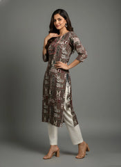 Woman wearing a patterned kurta with white pants on a gray background