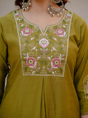 Green embroidered kurta with floral patterns on a plain background
