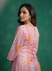 Woman wearing a pink and orange traditional outfit against a green chalkboard background