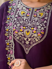Close-up of a purple garment with intricate floral embroidery