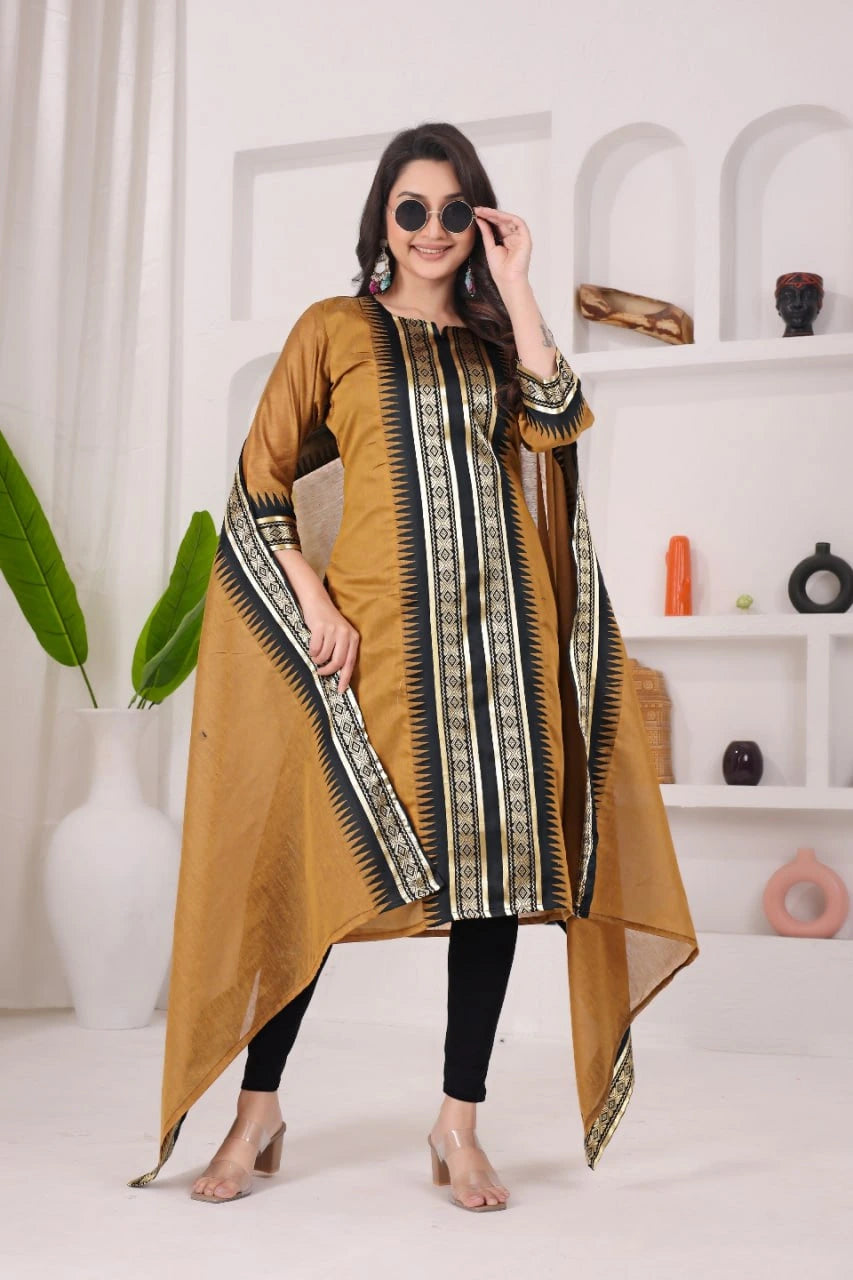 Woman wearing a mustard yellow kurta with black and white patterns in a minimalistic room.