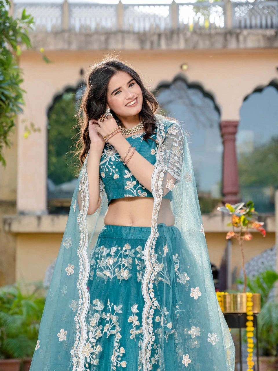Teal Green Sequins Thread Embroidered Soft Net Lehenga