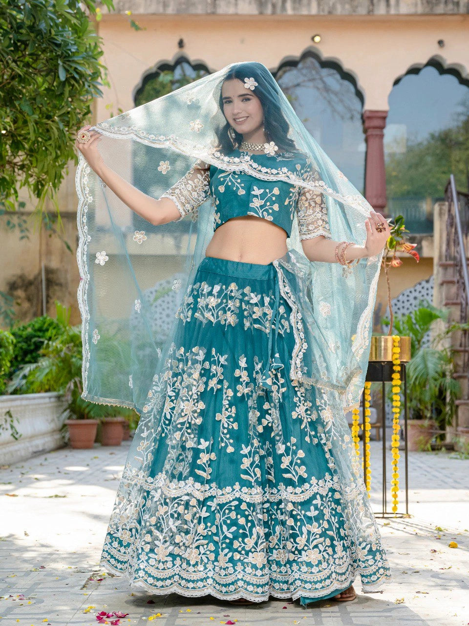 teal green sequins thread embroidered soft net lehenga