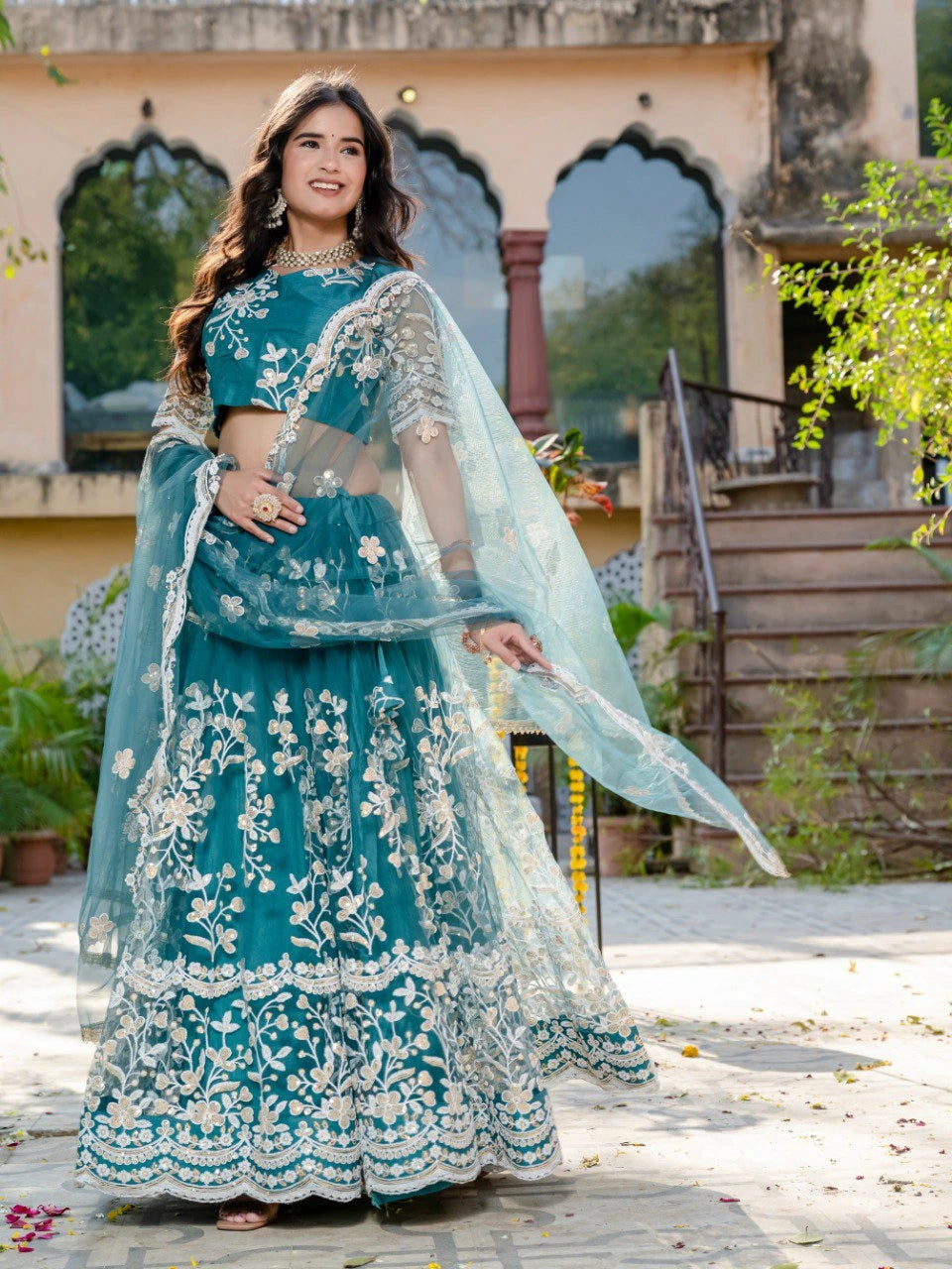 teal green sequins thread embroidered soft net lehenga