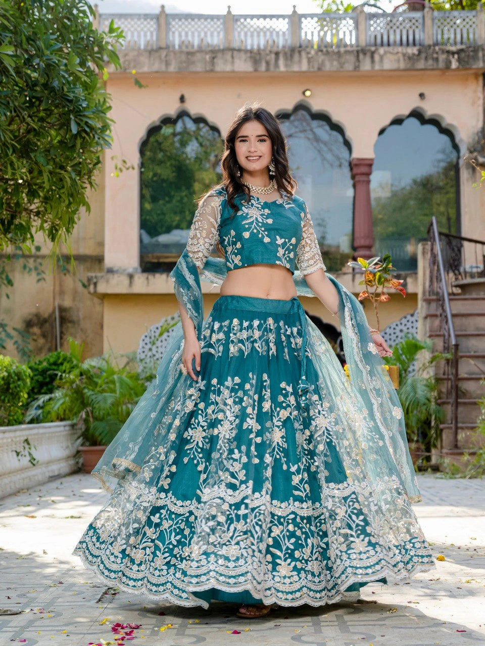 teal green sequins thread embroidered soft net lehenga